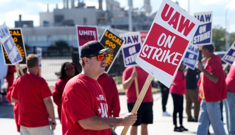 United Auto Workers member Austin Hodges walks the picket line at the Ford Michigan Assembly Plant in Wayne, Mich., Monday, Sept. 18, 2023. So far the strike is limited to about 13,000 workers at three factories â one each at GM, Ford and Stellantis.