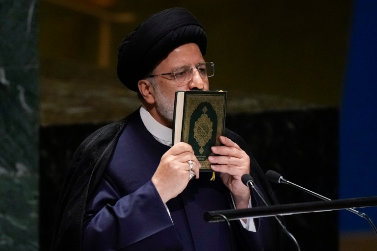 Iranâs President Ebrahim Raisi kisses a Quran as he addresses the 78th session of the United Nations General Assembly.