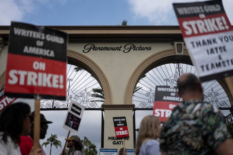 Demonstrators walk with signs during a rally outside the Paramount Pictures Studio in Los Angeles, Thursday, Sept. 21, 2023. Negotiations between striking screenwriters and Hollywood studios have resumed and will continue Thursday, the latest attempt to bring an end to pickets that have brought film and television productions to a halt.