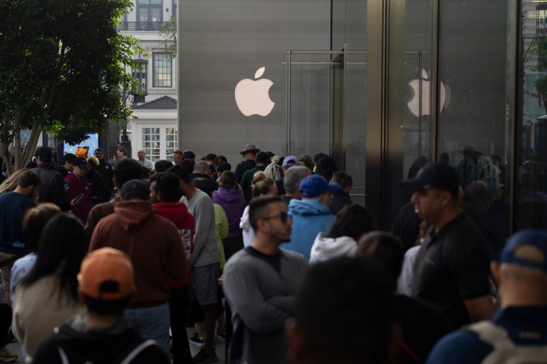 People wait in line outside an Apple Store at The Grove in Los Angeles, Friday, Sept. 22, 2023, to purchase the Apple's new iPhone 15 on its first day of sales. 