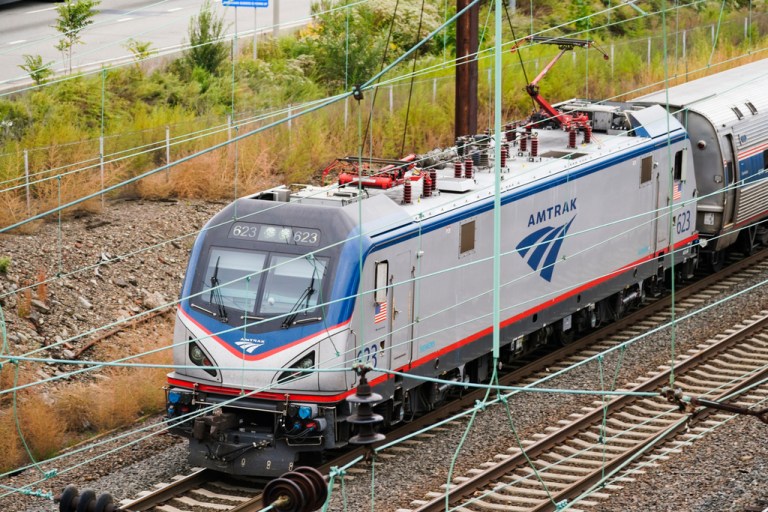 FILE - An Amtrak train departs 30th Street Station in Philadelphia on Oct. 27, 2021. The Biden administration announced Monday, Sept. 25, 2023, that it has awarded more than $1.4 billion to projects that improve railway safety and boost capacity, with much of the money coming from the 2021 infrastructure law.