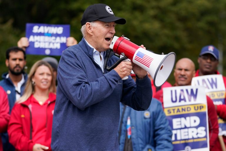 President Joe Biden joins striking United Auto Workers on the picket line, Tuesday, Sept. 26, 2023, in Van Buren Township, Michigan.