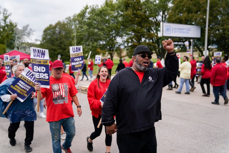 United Auto Workers walk the picket line during the auto workers strike Tuesday, Sept. 26, 2023, in Van Buren Township, Mich. 