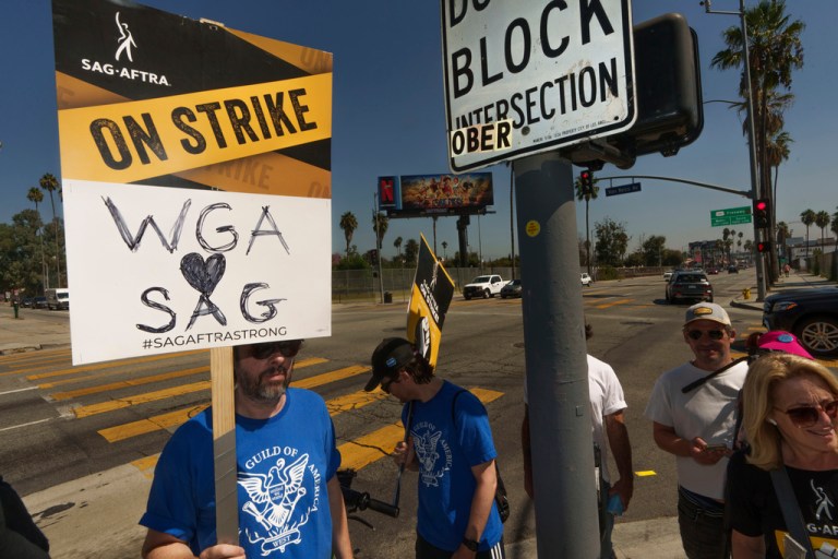 SAG-AFTRA actors walk on a picket line outside Netflix studios on Tuesday, Sep. 26, 2023, in Los Angeles.