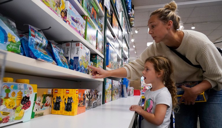 Quinn Byrne, 5 left, shops with her mother, Jamie Byrne at a Learning Express store in Lake Zurich, Ill., Tuesday, Sept. 26, 2023.