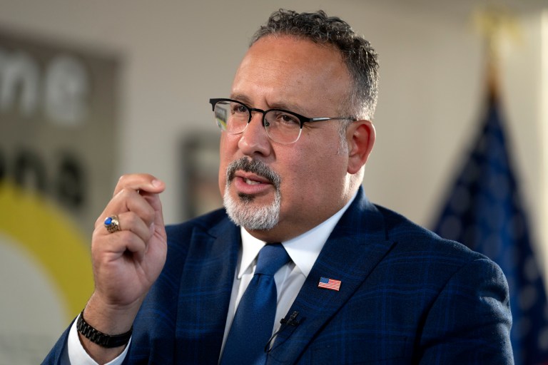 Education Secretary Miguel Cardona speaks during an interview in his office at the Department of Education on Sept. 20, 2023, in Washington.