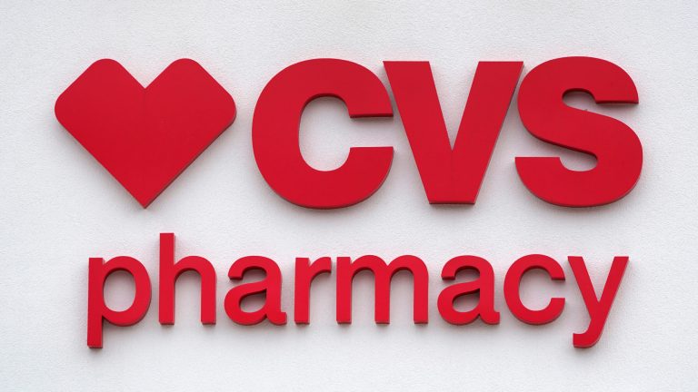 The CVS Pharmacy logo is displayed on a store on Aug. 3, 2021, in Woburn, Massachusetts. 