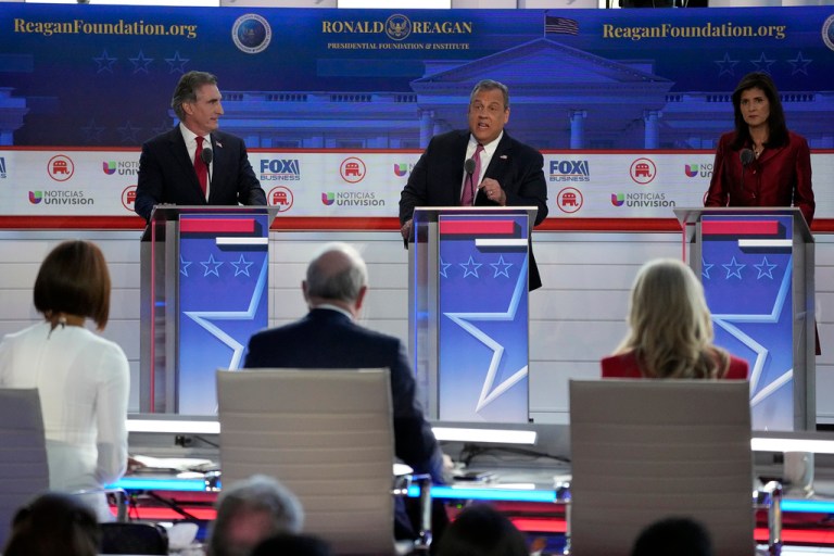 Former New Jersey Gov. Chris Christie, center, argues a point between North Dakota Gov. Doug Burgum, left, and former U.N. Ambassador Nikki Haley, during a debate Sept. 27, 2023.