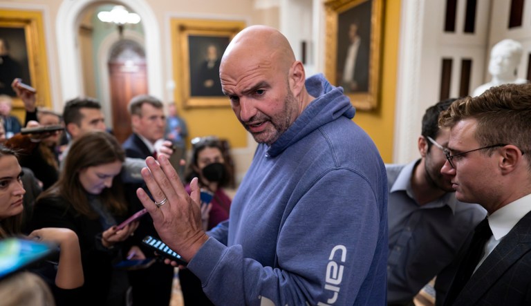 Sen. John Fetterman (D-PA) speaks to reporters outside a closed-door meeting of the Senate Democratic Caucus where Sen. Bob Menendez (D-NJ) discussed the federal charges accusing him of bribery at the Capitol in Washington, Thursday, Sept. 28, 2023. 