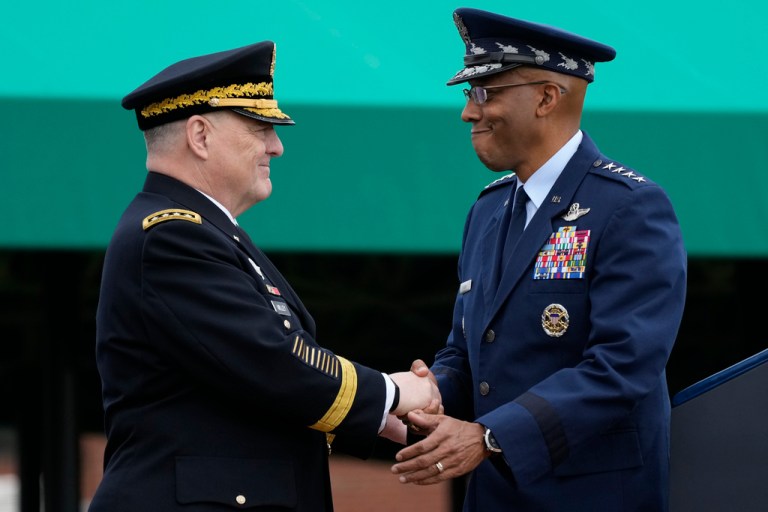 Retiring Chairman of the Joint Chiefs of Staff Gen. Mark Milley, left, and Gen. CQ Brown, Jr., right, shake hands during the Armed Forces Farewell Tribute at Joint Base Myer-Henderson Hall, Friday, Sept. 29, 2023, in Fort Meyer, Va. Milley's four-year term as chairman ends at midnight Saturday and Brown takes over Sunday. 