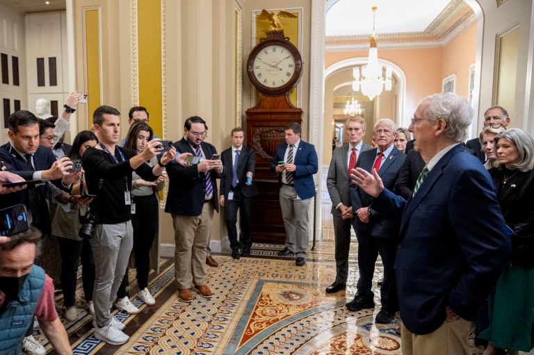 Senate Minority Leader Mitch McConnell (R-KY), accompanied by Republican Senators, speaks to reporters following a closed-door caucus meeting about preventing a federal government shutdown, Saturday, Sept. 30, 2023, in Washington. McConnell is urging his Senate colleagues to wait and see what the House can produce on a bipartisan basis before considering a Senate stopgap bill.