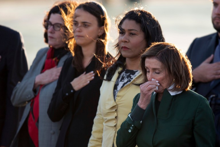 Mourners, including Katherine Feinstein, left, San Francisco Mayor London Breed, second from right, and Rep. Nancy Pelosi (D-CA), gather at San Francisco International Airport to receive the body of Sen. Dianne Feinstein (D-CA) on Sept. 30, 2023, in San Francisco. 