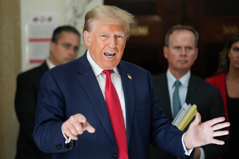 Former President Donald Trump speaks to the media during a break in his civil business fraud trial at New York Supreme Court, Tuesday, Oct. 3, 2023, in New York. Trump is in a New York court for the second day of his trial.