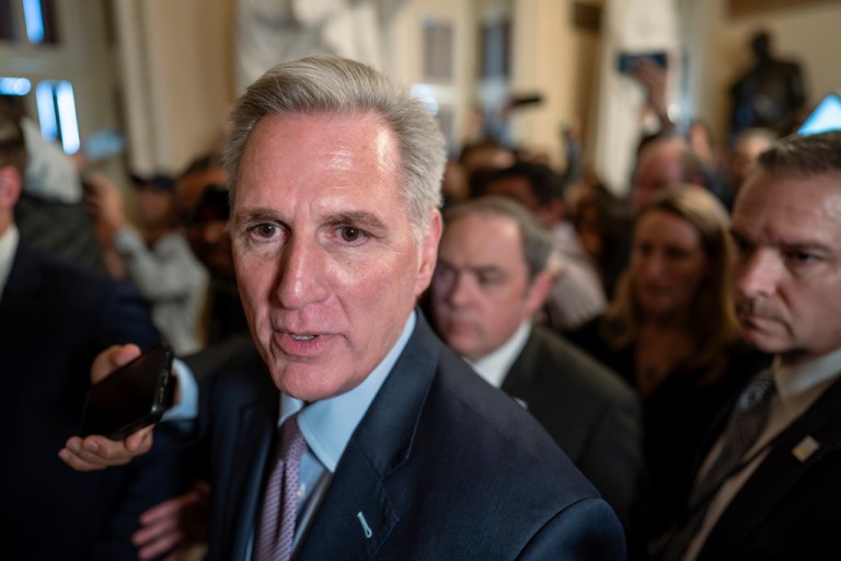 Speaker Kevin McCarthy (R-CA) is surrounded by press and police on the way to the chamber at the Capitol in Washington, Tuesday, Oct. 3, 2023.
