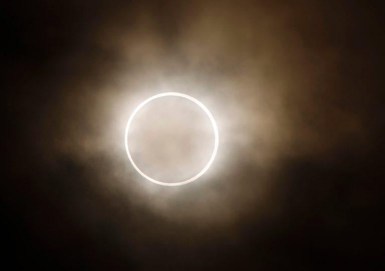 An annular eclipse is viewed from a waterfront park in Yokohama, Japan, near Tokyo, Monday, May 21, 2012.