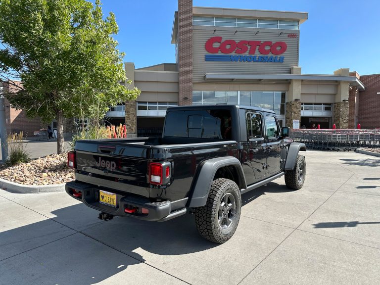 An unsold 2023 Jeep Gladiator pickup truck sits on display outside a Costco warehouse on Wednesday, Oct. 4, 2023, in Sheridan, Colorado.