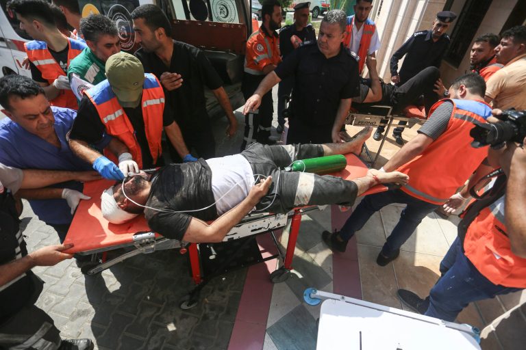 Wounded Palestinians are brought to hospital in Beit Lahiya, northern Gaza Strip, on Sunday, Oct. 8, 2023.