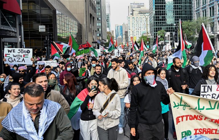 People take part in a protest for Palestine in Montreal on Sunday, Oct. 8, 2023. Hamas militants led a surprise attack on Israel from the Gaza Strip on Saturday, Oct. 7, leading to many casualties on both sides and retaliation strikes by Israel into Gaza. 