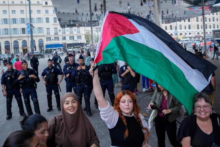 A woman waves a Palestinian flag during a pro-Palestinian rally in Marseille, France, Tuesday, Oct. 10, 2023.
