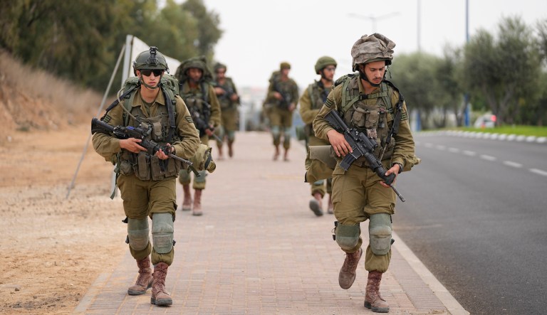 Israeli soldiers arrive at Sderot, a town close to the Gaza Strip, Wednesday, Oct.11, 2023.