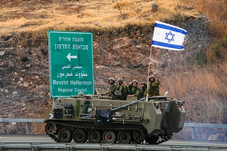 Israeli soldiers drive an armored personal carrier near the border with Lebanon, Wednesday, Oct. 11, 2023. (AP Photo/Ariel Schalit)