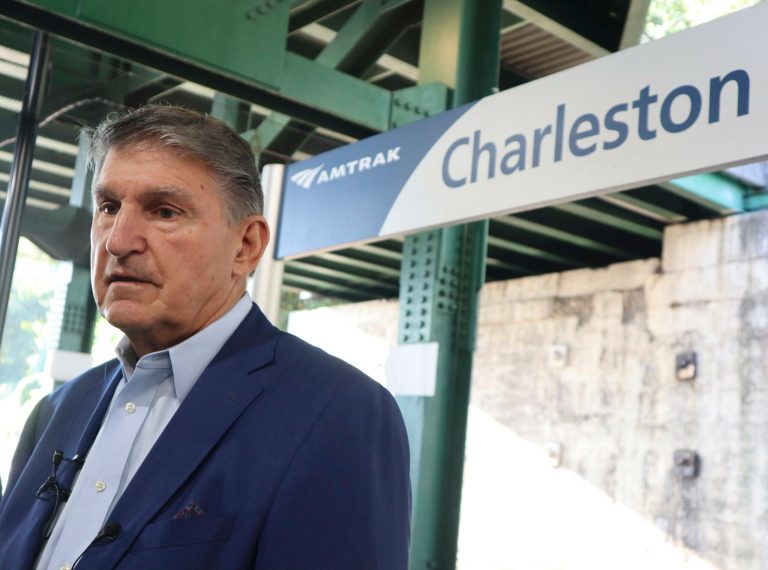 Sen. Joe Manchin (D-WV) speaks with reporters outside the newly renovated Amtrak train station in Charleston, West Virginia, on Thursday, Oct. 12, 2023.