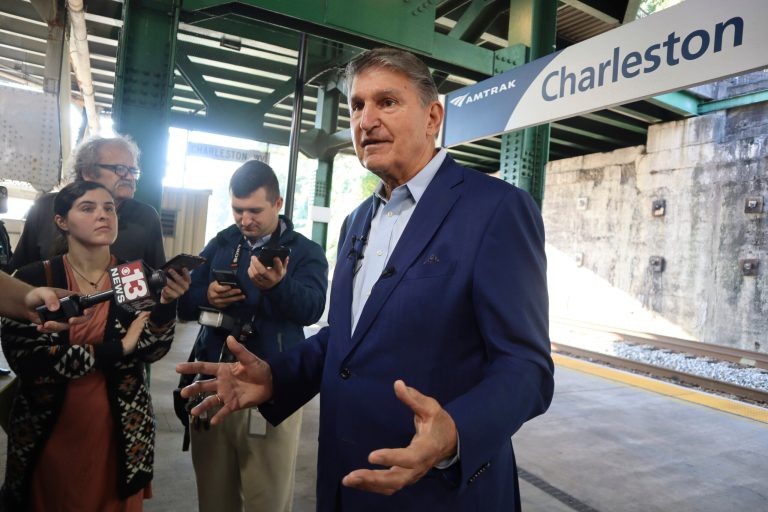 Sen. Joe Manchin (D-WV) speaks with reporters outside the newly renovated Amtrak train station in Charleston, West Virginia, on Thursday, Oct. 12, 2023.