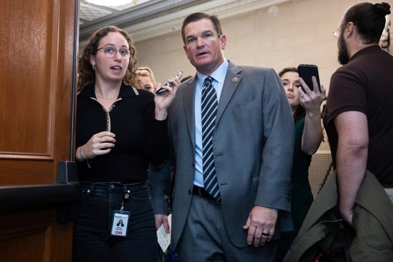 Rep. Austin Scott (R-GA, center) speaks with reporters as he arrives for a House Republican Conference meeting after announcing that he is running for speaker of the House on Capitol Hill.