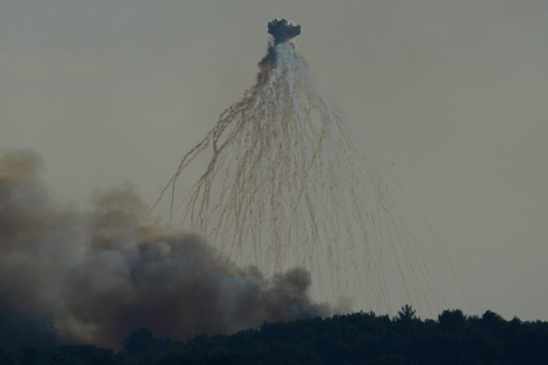 A shell from Israeli artillery explodes over the border line at the Alma al-Shaab border village with Israel, south Lebanon, Friday, Oct. 13, 2023. 