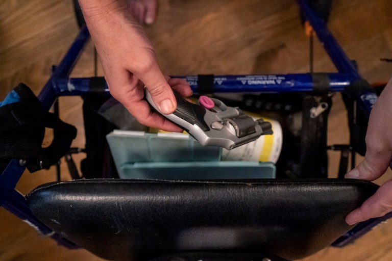 Janet Paulsen shows the gun she sometimes keeps in her walker at her home in Acworth, Ga., Monday, Aug. 7, 2023. 