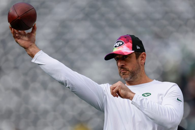 New York Jets quarterback Aaron Rodgers throws before an NFL game against the Philadelphia Eagles, Sunday, Oct. 15, 2023, in East Rutherford, New Jersey.