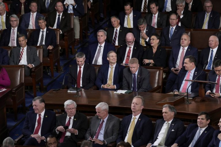 Rep. Jim Jordan (R-OH), seated center, a top Trump ally, listens as voting gets underway in the House to elect a new speaker, at the Capitol in Washington, Tuesday, Oct. 17, 2023.