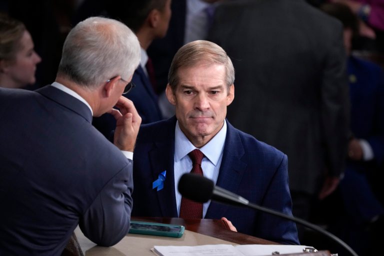 Rep. Jim Jordan (R-OH) confers with Rep. Patrick McHenry (R-NC), the temporary leader of the House of Representatives, as the House convenes for a second day of balloting to elect a speaker, at the Capitol in Washington, Wednesday, Oct. 18, 2023.