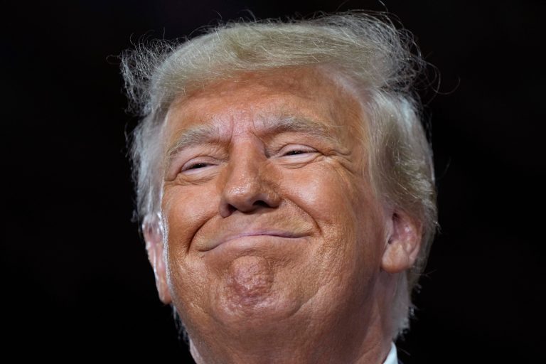 Former President Donald Trump speaks during a commit to caucus rally, Oct. 16, 2023, in Adel, Iowa. 