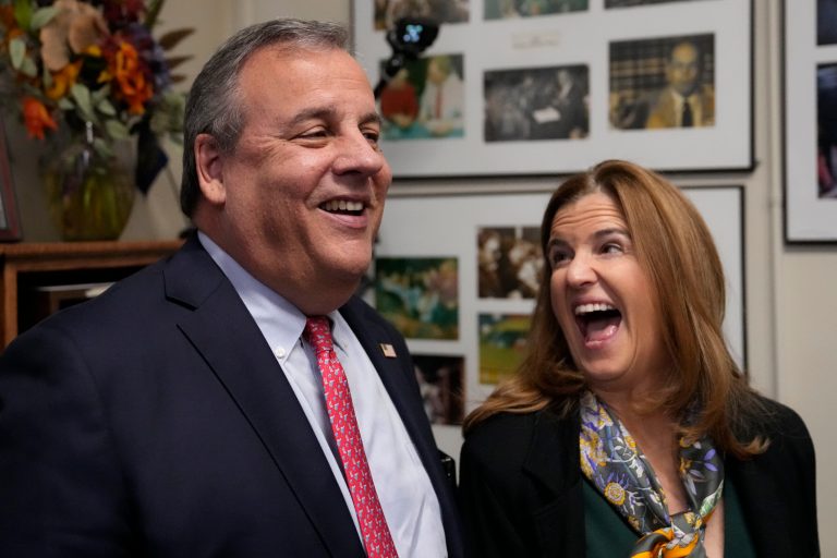Republican presidential candidate and former New Jersey Gov. Chris Christie, left, laughs with his wife Mary Pat while filing paperwork to be on the presidential primary ballot at the State House, Thursday, Oct. 19, 2023, in Concord, New Hampshire.