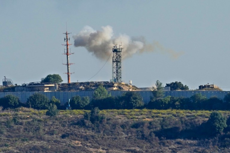 Smoke rises from inside an Israeli army position which was hit by Hezbollah fighters as seen from Tair Harfa village, a Lebanese border village with Israel, south Lebanon, Friday, Oct. 20, 2023.