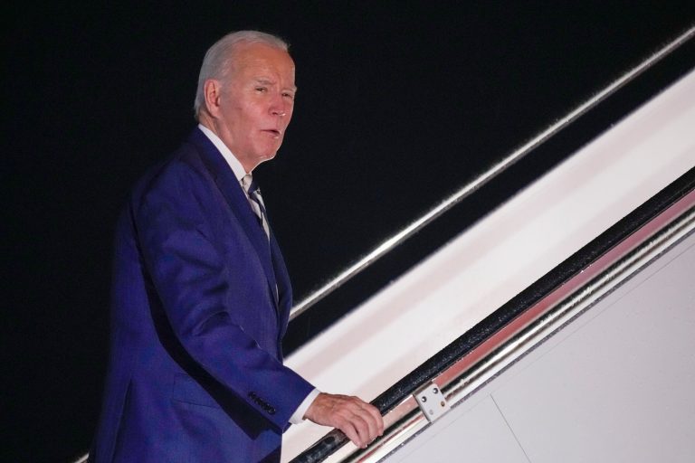 President Joe Biden answers questions as he boards Air Force One at Andrews Air Force Base, Maryland, on Friday, Oct. 20, 2023, to travel to Rehoboth Beach, Delaware.