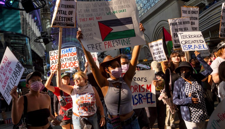Pro-Palestinian protesters march by casinos in Las Vegas on Sunday, Oct. 22, 2023.