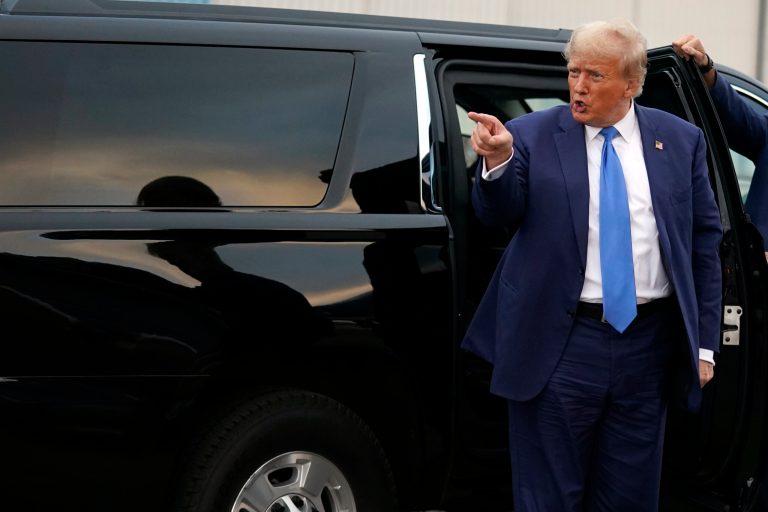 Republican presidential candidate former President Donald Trump gestures as he prepares to depart Manchester-Boston Regional Airport, Monday Oct. 23, 2023, in Londonderry, N.H. 