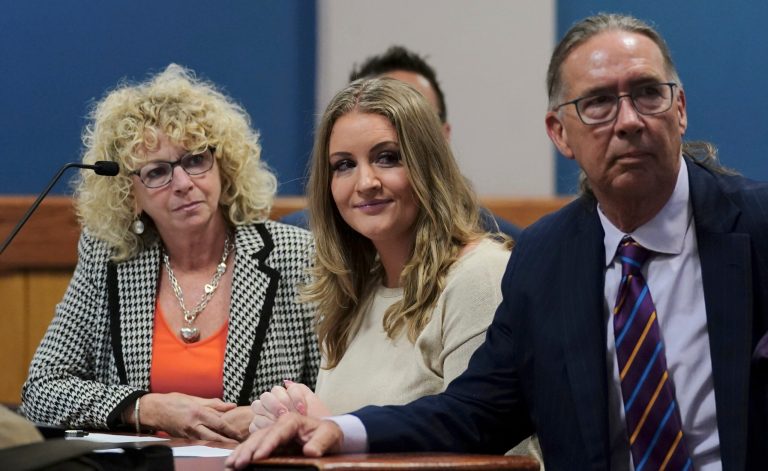 Jenna Ellis reacts with her lawyers after reading a statement inside Fulton Superior Court Judge Scott McAfee's Fulton County Courtroom, Tuesday, Oct. 24, 2023, in Atlanta.
