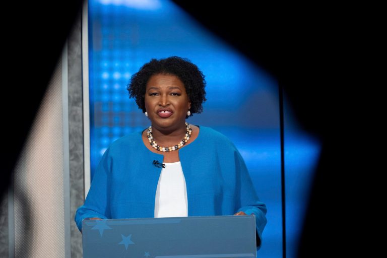 FILE - Democratic challenger Stacey Abrams faces off with Republican Georgia Gov. Brian Kemp in a televised debate, Oct. 30, 2022, in Atlanta. (AP Photo/Ben Gray, File)