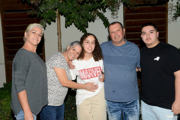 This undated photo provided by the Israeli Security Agency on Monday, Oct. 30, 2023, shows Israeli soldier Pvt. Ori Megidish, center, with relatives. On Monday, the Israeli army said that Megidish was freed from Hamas captivity during Israel's ground offensive in the Gaza Strip. Megidish was among over 230 people taken hostage in Hamas' bloody Oct. 7 cross-border raid.