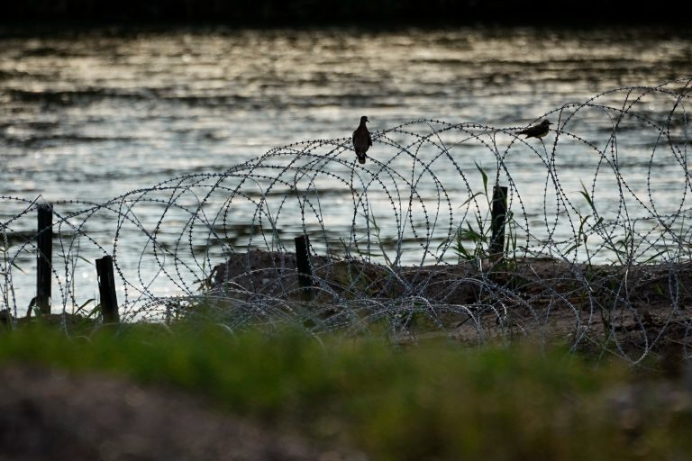 Birds rest on concertina wire, or razor wire, along the Rio Grande in Eagle Pass, Texas, on July 6, 2023. A federal judge on Monday, Oct. 30, ordered Border Patrol agents not to interfere with the razor wire that Texas has installed at a busy crossing on the U.S.-Mexico border, keeping in place one of Republican Gov. Greg Abbott's newest measures over immigration. 