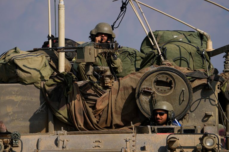 Israeli soldiers move towards the Gaza Strip border in southern Israel on Wednesday, Nov. 1, 2023.
