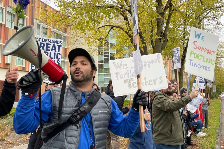 Teachers and their supporters hold signs, chant, and rally the crowd with bullhorns on the first day of a teacher's strike in Portland, Oregon on Nov. 1, 2023. The Portland Association of Teachers said its first-ever strike in the district stemmed from concerns over large class sizes, salaries that haven't kept up with inflation, and a lack of resources. 