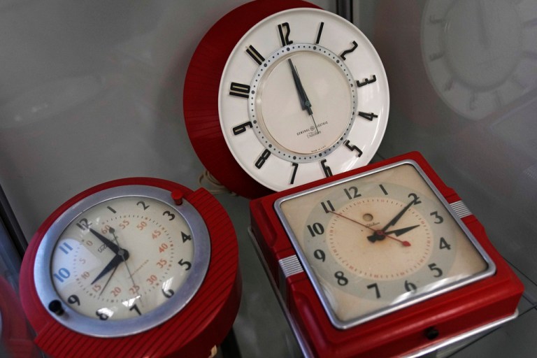 FILE - A selection of vintage clocks are displayed at the Electric Time Company, March 9, 2023, in Medfield, Mass.