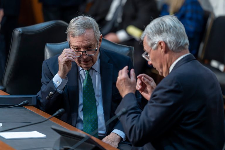 Senate Judiciary Committee Chairman Dick Durbin (D-IL) confers with Sen. Sheldon Whitehouse (D-RI), right, during a business meeting at the Capitol in Washington, Thursday, Nov. 2, 2023.