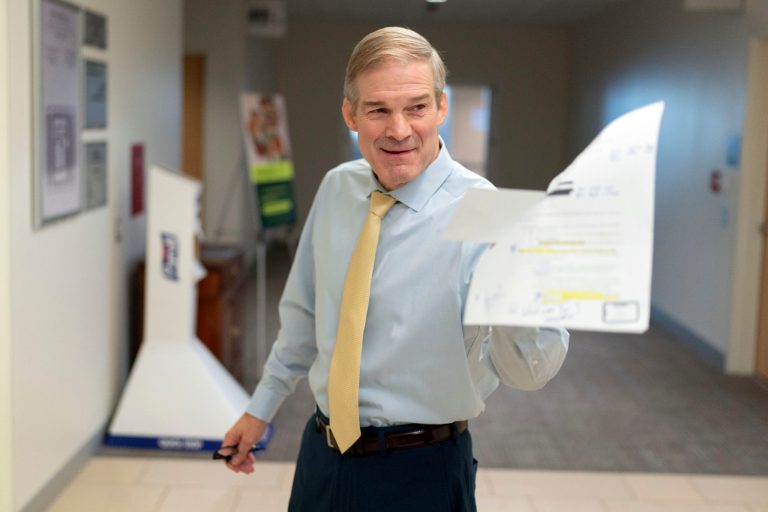 Rep. Jim Jordan (R-OH) holds a Justice Department email as he speaks with reporters after hearing from U.S. Attorney David Weiss in a transcribed interview before members of the House Judiciary Committee on Tuesday, Nov. 7, 2023, in Washington. Jordan sent a subpoena letter Friday to DHS Secretary Alejandro Mayorkas.