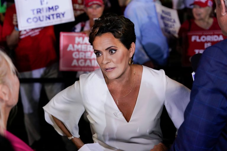 Former Arizona Republican gubernatorial candidate Kari Lake talks in the spin room after former President Donald Trump held a campaign rally in Hialeah, Florida, Wednesday, Nov. 8, 2023.