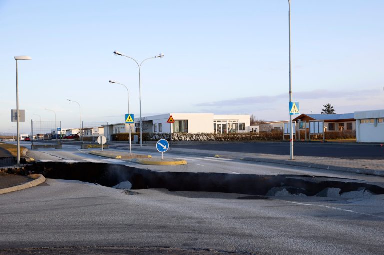 Steam rises from a fissure in a road Monday Nov. 13, 2023, near the town of Grindavik, Iceland, following seismic activity. Residents were allowed to return to their homes briefly Monday after being told to evacuate Saturday, when increasing concern about a potential volcanic eruption caused civil defense authorities to declare a state of emergency in the region.